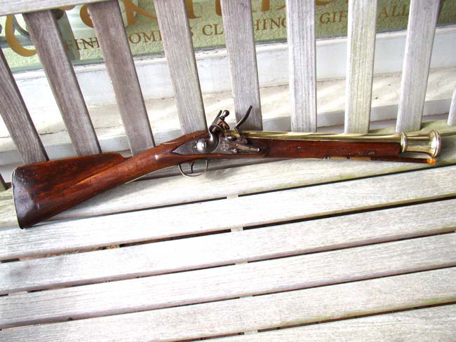 A British brass barreled flintlock Blunderbuss by William Mewis & Co., Birmingham, 1765-1782.
